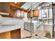 Functional laundry room with washer, dryer, storage, and utility sink at 10222 W Ida Ave # 237, Littleton, CO 80127