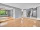 Bright, open-concept living room with hardwood floors and a staircase at 10222 W Ida Ave # 237, Littleton, CO 80127