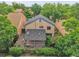 Overhead view of a home featuring a spacious deck and mature trees at 10222 W Ida Ave # 237, Littleton, CO 80127