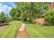 Well-manicured community walkway with lush grass and a quaint lamppost along the pathway at 10222 W Ida Ave # 237, Littleton, CO 80127