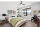 Cozy bedroom with large window, and neutral color palette at 528 Nesting Eagles Way, Berthoud, CO 80513