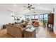 Living room with hardwood floors, fireplace, and comfortable seating at 528 Nesting Eagles Way, Berthoud, CO 80513