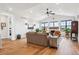 Spacious living room with vaulted ceiling, fireplace and hardwood floors at 528 Nesting Eagles Way, Berthoud, CO 80513