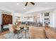 Open concept living room with kitchen and dining area views at 528 Nesting Eagles Way, Berthoud, CO 80513