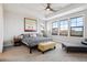 Relaxing main bedroom with ceiling fan and multiple windows at 528 Nesting Eagles Way, Berthoud, CO 80513