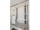 Luxurious shower with glass enclosure, tile surround, and built-in seat at 528 Nesting Eagles Way, Berthoud, CO 80513