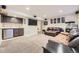 Finished basement with wet bar, mini fridge, and comfortable seating area for relaxation or entertainment at 5572 Fullerton Cir, Highlands Ranch, CO 80130