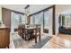 Inviting dining room featuring hardwood floors, a large table, and ample natural light at 5572 Fullerton Cir, Highlands Ranch, CO 80130