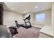 Home gym featuring a treadmill, rowing machine, and weight bench for convenient workouts at 5572 Fullerton Cir, Highlands Ranch, CO 80130