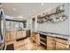 Spacious kitchen featuring a sink with a window, wood cabinets, and stone countertops at 5572 Fullerton Cir, Highlands Ranch, CO 80130