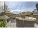 Backyard patio with fountain, outdoor seating and plantings for relaxing backyard experience at 5572 Fullerton Cir, Highlands Ranch, CO 80130
