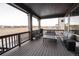 Covered deck with patio furniture and mountain views at 15601 W Eureka Ave, Morrison, CO 80465