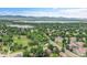 Breathtaking aerial view of a community with parks, lakes, and mountains in the background, showcasing its natural beauty at 8357 Dudley Ct, Arvada, CO 80005