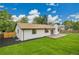 Newly renovated home featuring a spacious deck overlooking a luscious backyard at 8357 Dudley Ct, Arvada, CO 80005