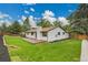 Beautiful backyard featuring a spacious wooden deck and a green, well-maintained lawn at 8357 Dudley Ct, Arvada, CO 80005