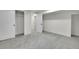 Basement bedroom with neutral carpet, white walls and trim, and closet space at 8357 Dudley Ct, Arvada, CO 80005