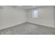 Finished basement bedroom with a window and neutral colored carpet at 8357 Dudley Ct, Arvada, CO 80005