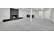 Finished basement with fireplace, carpet, and wet bar for entertaining at 8357 Dudley Ct, Arvada, CO 80005