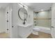 Modern bathroom featuring tile flooring, updated vanity and a shower-tub combo at 8357 Dudley Ct, Arvada, CO 80005
