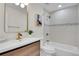Modern bathroom featuring stylish fixtures and a tiled shower at 8357 Dudley Ct, Arvada, CO 80005