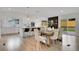 Open concept dining area with an eat-in kitchen and a sliding glass door at 8357 Dudley Ct, Arvada, CO 80005