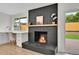 Stylish living area with a modern fireplace and built-in workspace at 8357 Dudley Ct, Arvada, CO 80005