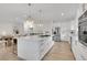 Eat-in kitchen features stainless steel appliances and modern finishes at 8357 Dudley Ct, Arvada, CO 80005
