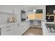 Bright kitchen offers a built-in oven and a custom workspace at 8357 Dudley Ct, Arvada, CO 80005