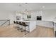 Spacious kitchen features a large island, breakfast bar and stainless steel appliances at 8357 Dudley Ct, Arvada, CO 80005