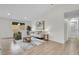 Bright and inviting living room featuring neutral colors, hardwood floors, and stylish decor at 8357 Dudley Ct, Arvada, CO 80005