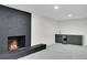 Beautiful living room with a fireplace and a beverage bar for entertaining at 8357 Dudley Ct, Arvada, CO 80005