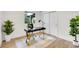 Home office featuring modern black desk, gold accents and indoor plants for a relaxing workspace at 8357 Dudley Ct, Arvada, CO 80005
