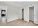 Empty white room with new flooring and closet at 8357 Dudley Ct, Arvada, CO 80005