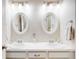 Clean and bright bathroom with dual vanities and modern fixtures at 15205 W Baker Ave, Lakewood, CO 80228
