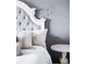 Close up of the bed in bedroom featuring stylish pillows and ornate side table at 15205 W Baker Ave, Lakewood, CO 80228