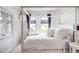 Bright, airy bedroom with a four-poster bed and plenty of natural light at 15205 W Baker Ave, Lakewood, CO 80228