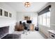 Inviting home office with a wooden desk, comfortable seating, and natural light at 15205 W Baker Ave, Lakewood, CO 80228
