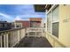 Balcony shot featuring wooden deck, metal awning and view of nearby buildings at 2829 Syracuse Ct # 237, Denver, CO 80238