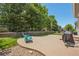 Backyard patio with a concrete surface, perfect for outdoor entertaining and relaxing, plus a well-maintained lawn at 8677 S Buchanan Way, Aurora, CO 80016