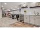 Basement bar area with modern cabinetry, a wine fridge, and a stylish backsplash at 8677 S Buchanan Way, Aurora, CO 80016