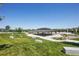 Community park featuring a covered picnic area with benches, landscaping, and walkway at 8677 S Buchanan Way, Aurora, CO 80016