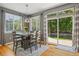 Dining area with natural lighting, hardwood floors, and a view of the outdoors at 8677 S Buchanan Way, Aurora, CO 80016