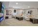Spacious living room featuring plush sectional seating, stylish decor, and a modern fireplace at 8677 S Buchanan Way, Aurora, CO 80016