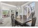Combined living spaces with carpeted floors feature a cozy fireplace and staircase leading to the upper level at 8677 S Buchanan Way, Aurora, CO 80016
