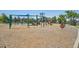 Community playground with swings, slides, climbing structures and wood chip ground cover at 8677 S Buchanan Way, Aurora, CO 80016