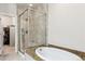 Modern bathroom featuring a tiled shower, soaking tub and granite countertops at 6765 S Old Hammer Ct, Aurora, CO 80016