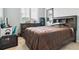 Cozy bedroom featuring a window with blinds, carpet and ample space at 6765 S Old Hammer Ct, Aurora, CO 80016