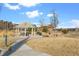 Community park featuring a gazebo, benches, walking paths, and green spaces for outdoor enjoyment at 6765 S Old Hammer Ct, Aurora, CO 80016