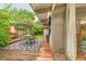 Outdoor deck features green patio furniture and a unique fireplace, perfect for entertaining at 1831 S Ivanhoe St, Denver, CO 80224
