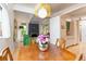 Open floorplan dining area adjacent to the kitchen and living area with a cozy fireplace at 1831 S Ivanhoe St, Denver, CO 80224